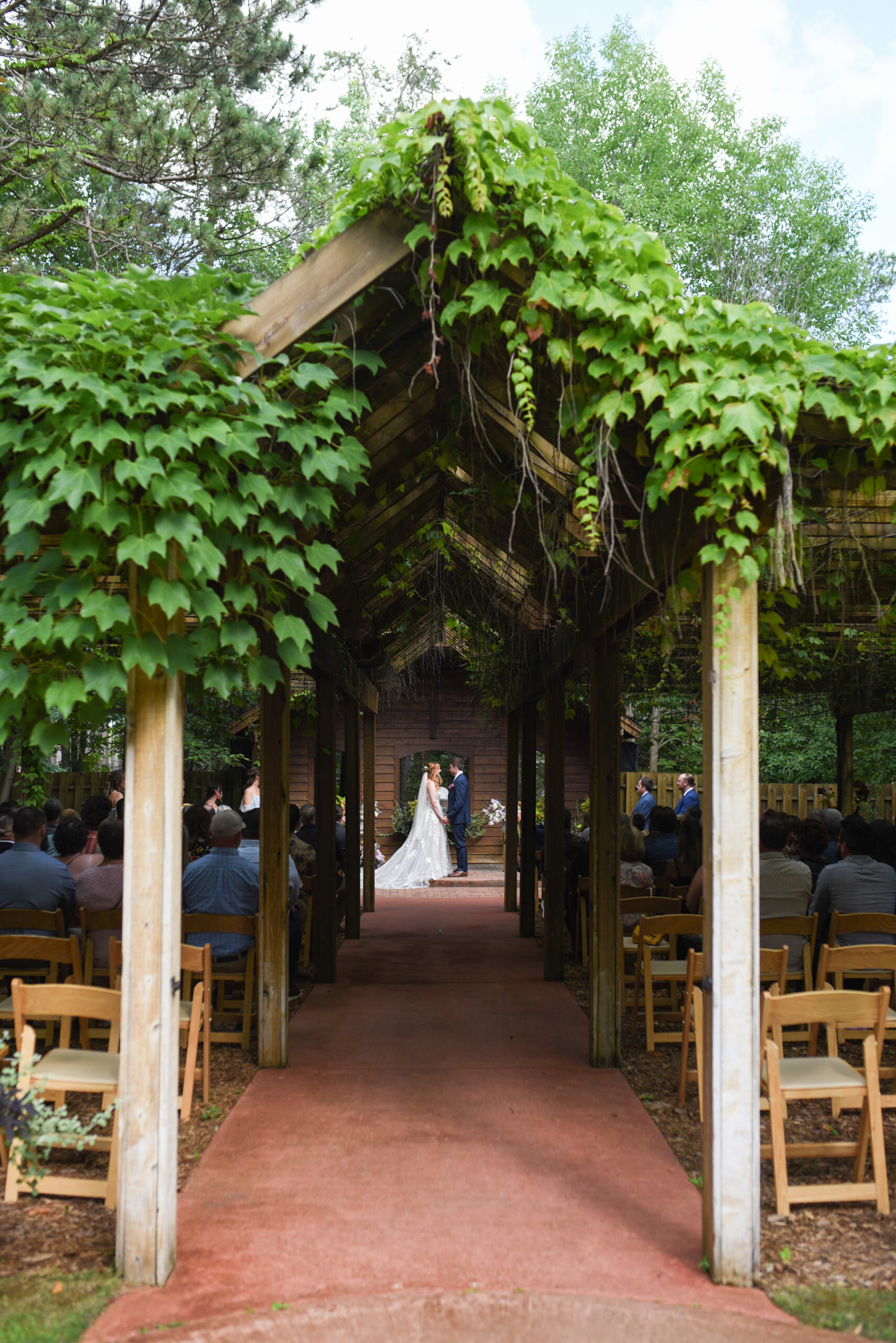 bride and groom during ceremony at blue bridge event center wedding in traverse city michigan wedding photography