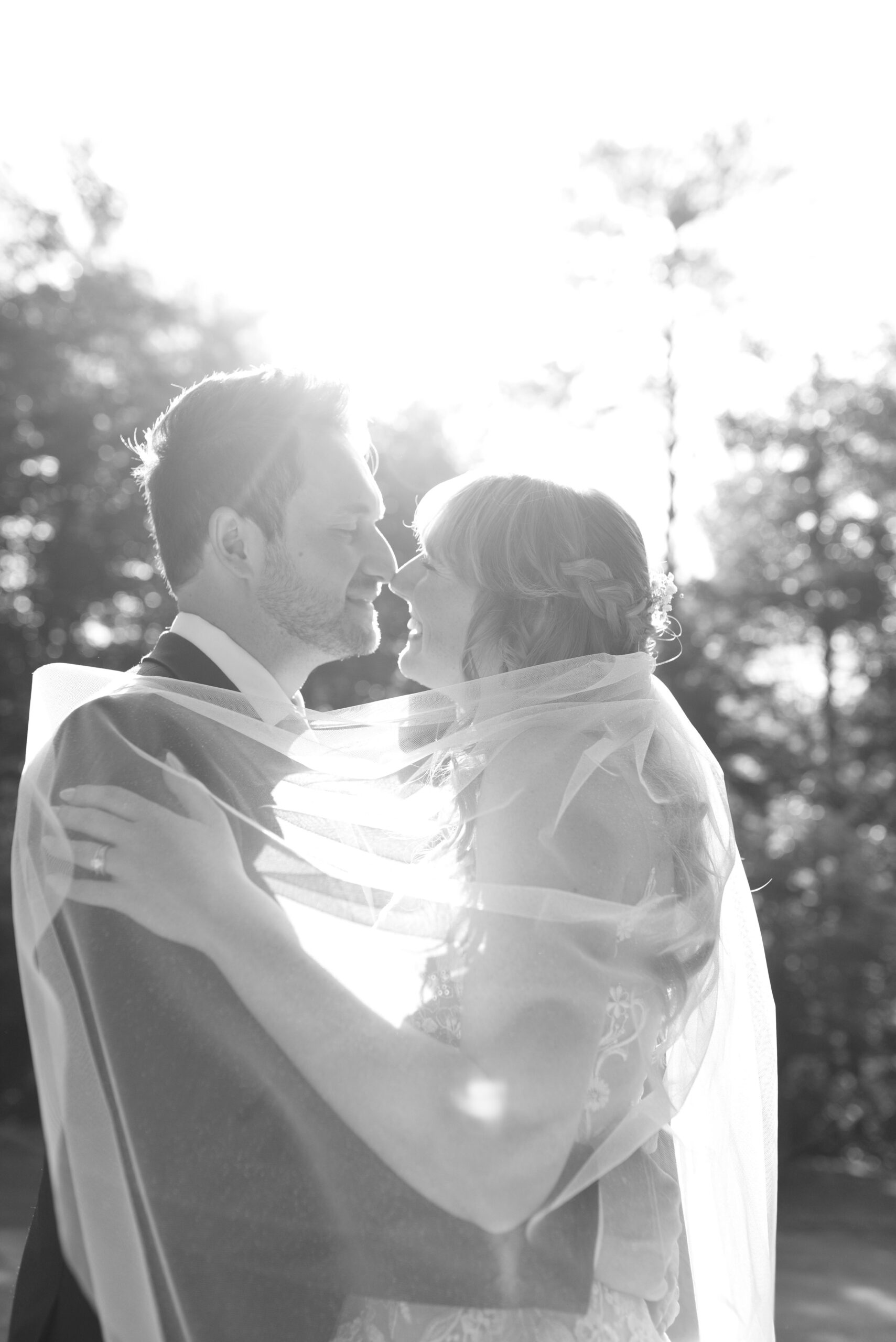 bride and groom kiss at blue bridge event center wedding in traverse city michigan wedding photography