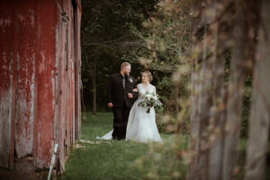 bride and groom at blue sky barn in elmira michigan wedding photographer