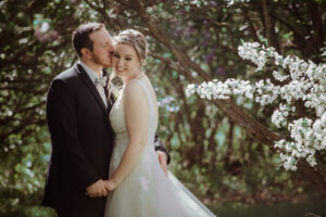 bride and groom at blue sky barn in elmira michigan wedding photographer