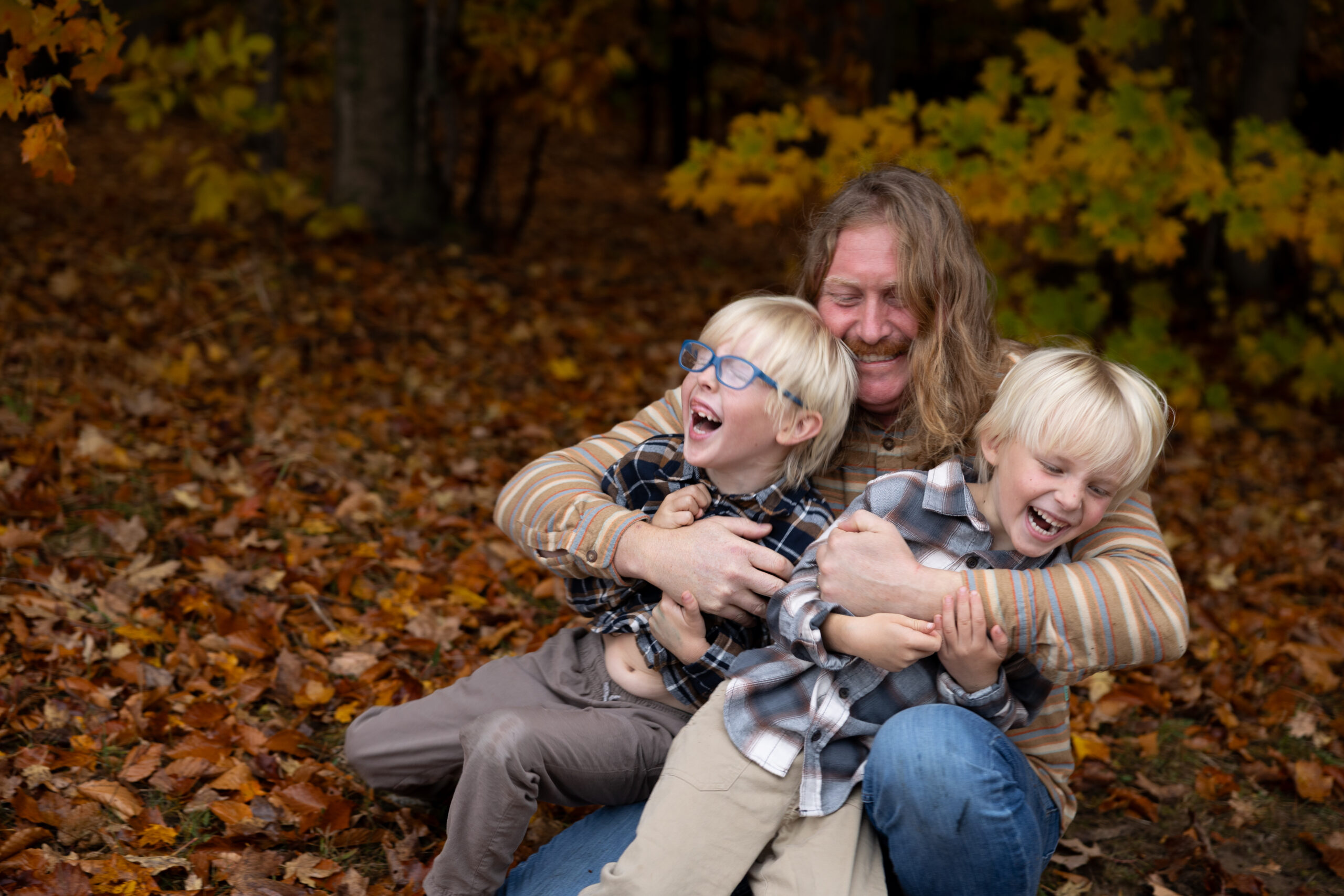 family laughing family photography session empire michigan lina lavonne photography