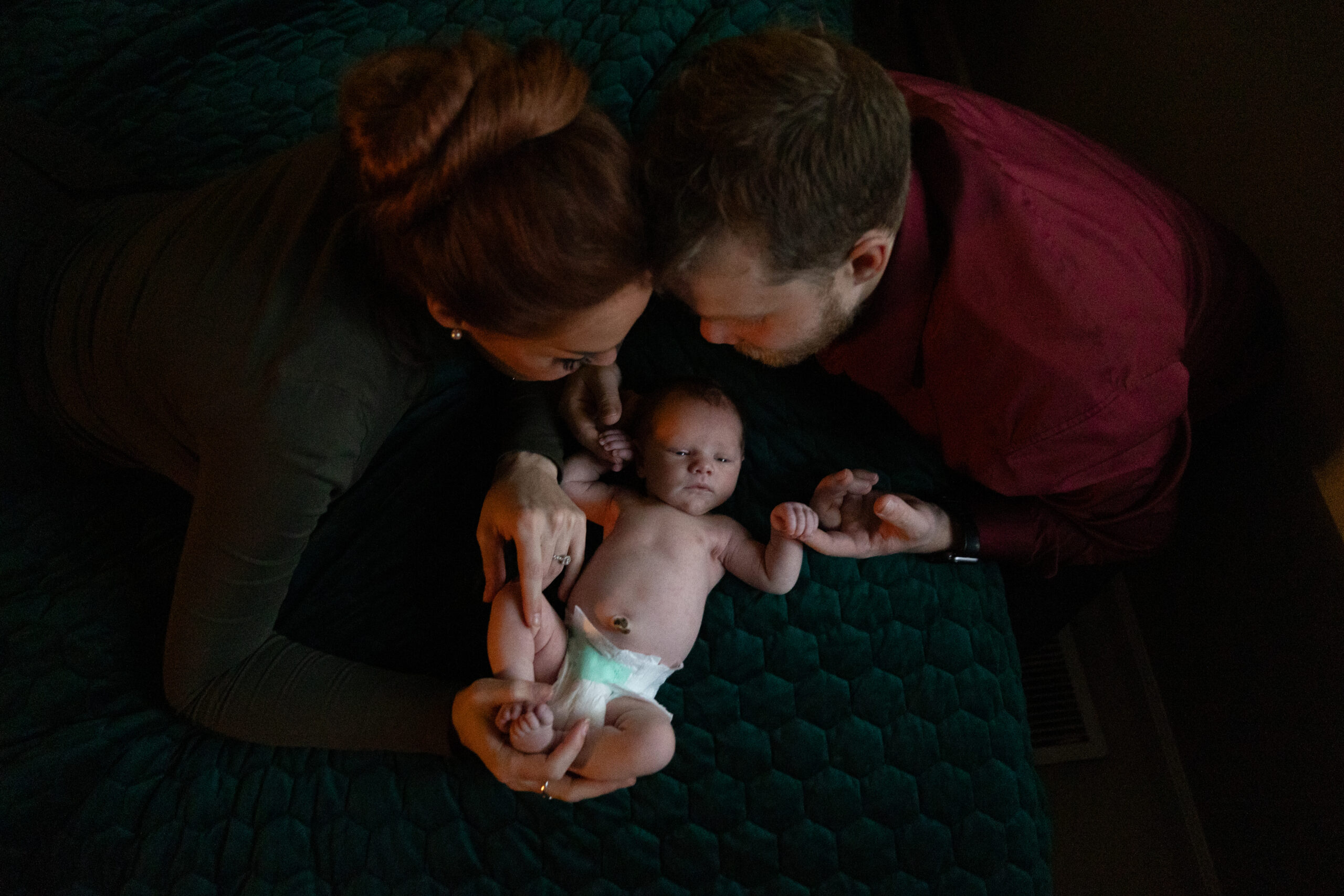 baby with parents newborn photos traverse city photographer