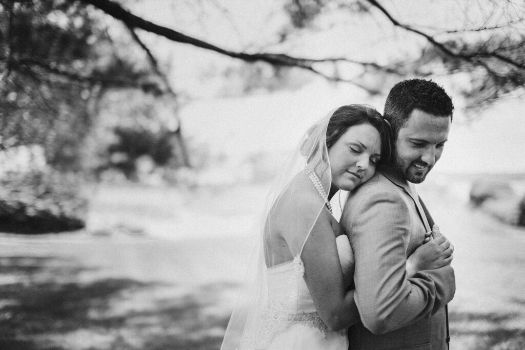 couple embracing at wedding in traverse city wedding photographer