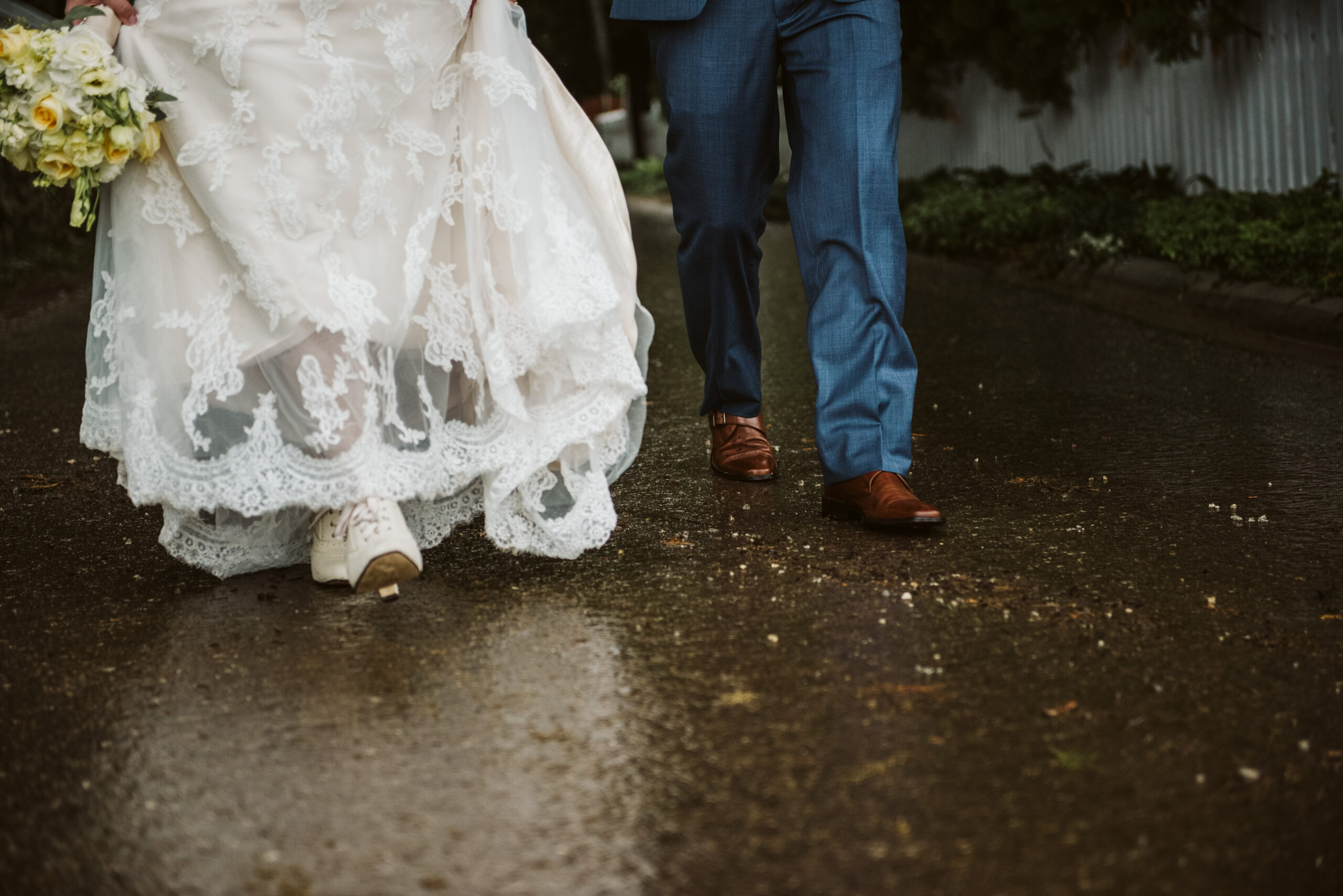 bride and groom walking at Mackinac Island wedding photographer