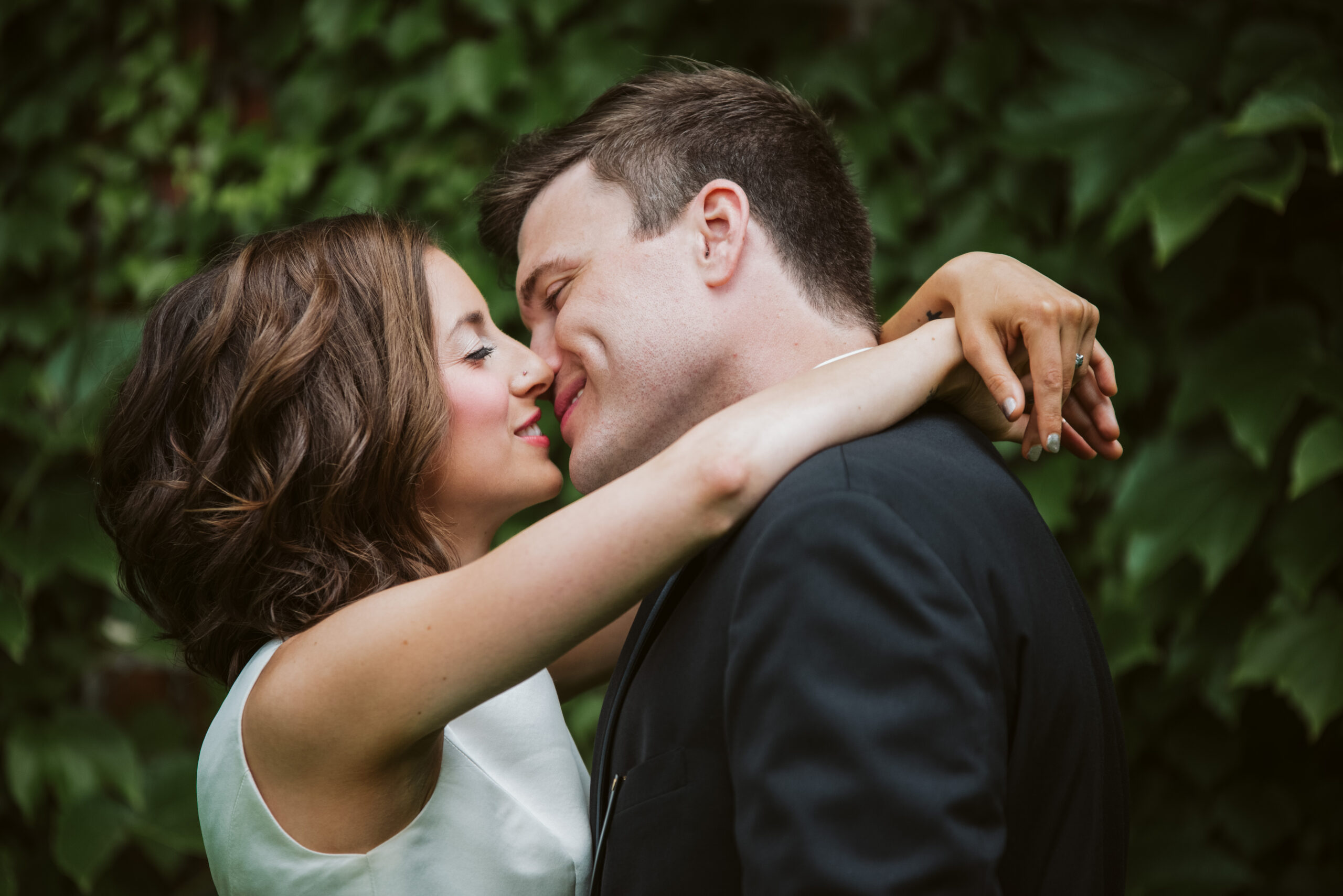 bride and groom kissing downtown traverse city wedding photographer