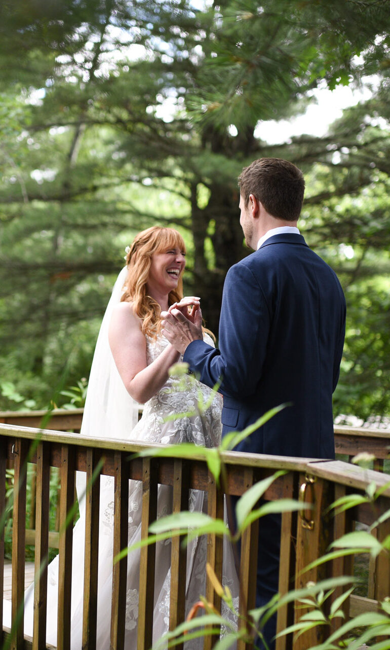 blue-bridge-event-center-Traverse-city-michigan-wedding-08-c bride and groom during first look at blue bridge event center grawn michigan Used in Northern Michigan Wedding Guide