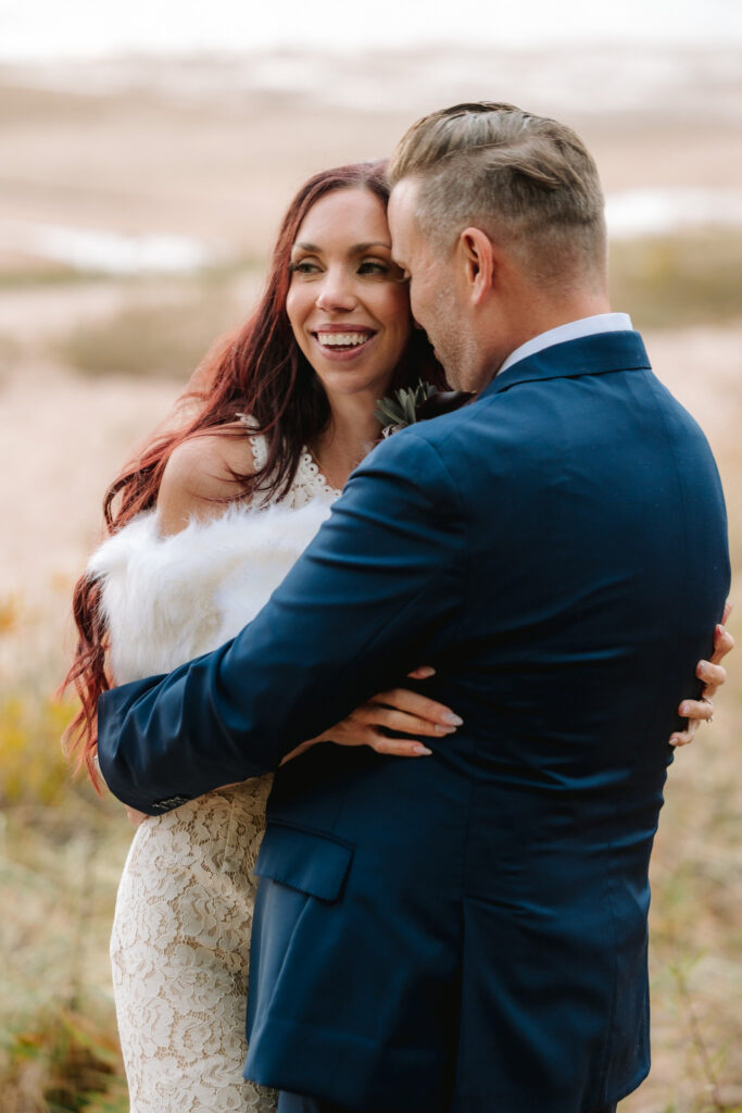 peninsula-room-traverse-city-wedding-photographer-2 bride and groom on beach peninsula room traverse city wedding photography