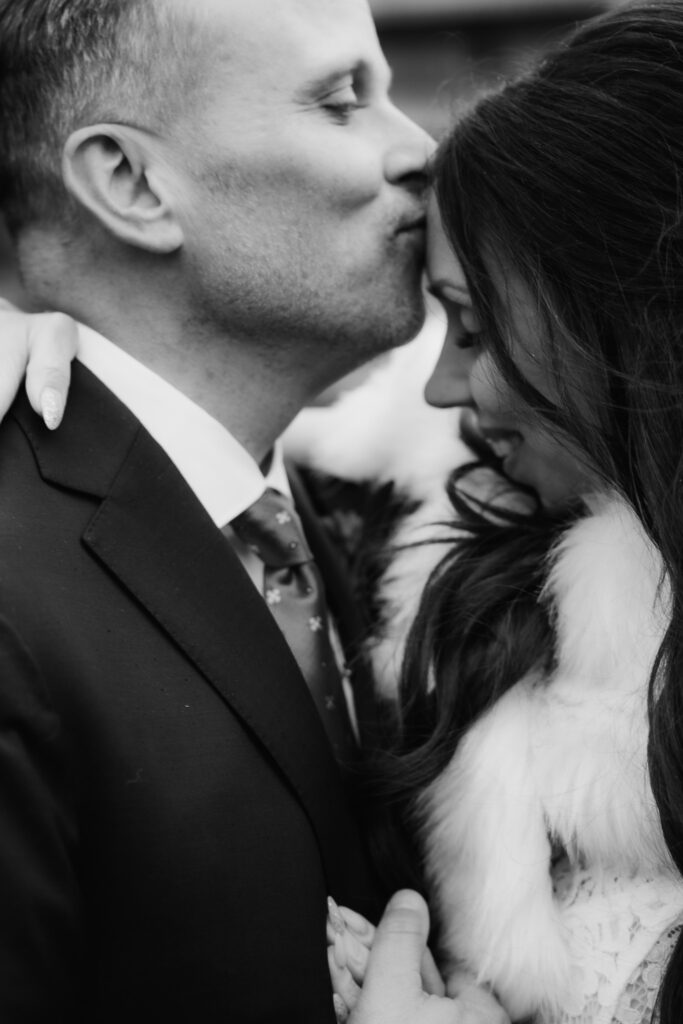 bride and groom kissing at peninsula room traverse city wedding photography