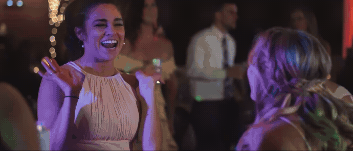 bridemaid dancing at blue bridge wedding reception in traverse city