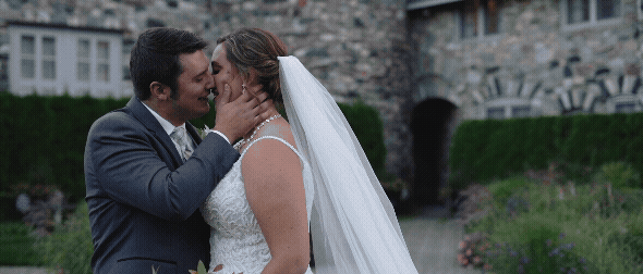 bride and groom cuddling up together during portrait sessions at castle farms. video by traverse city videographer
