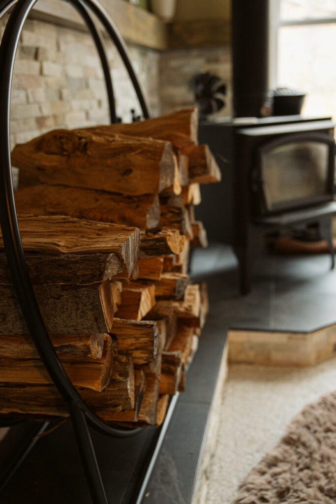 pile of split wood inside a traverse city home during family newborn photos