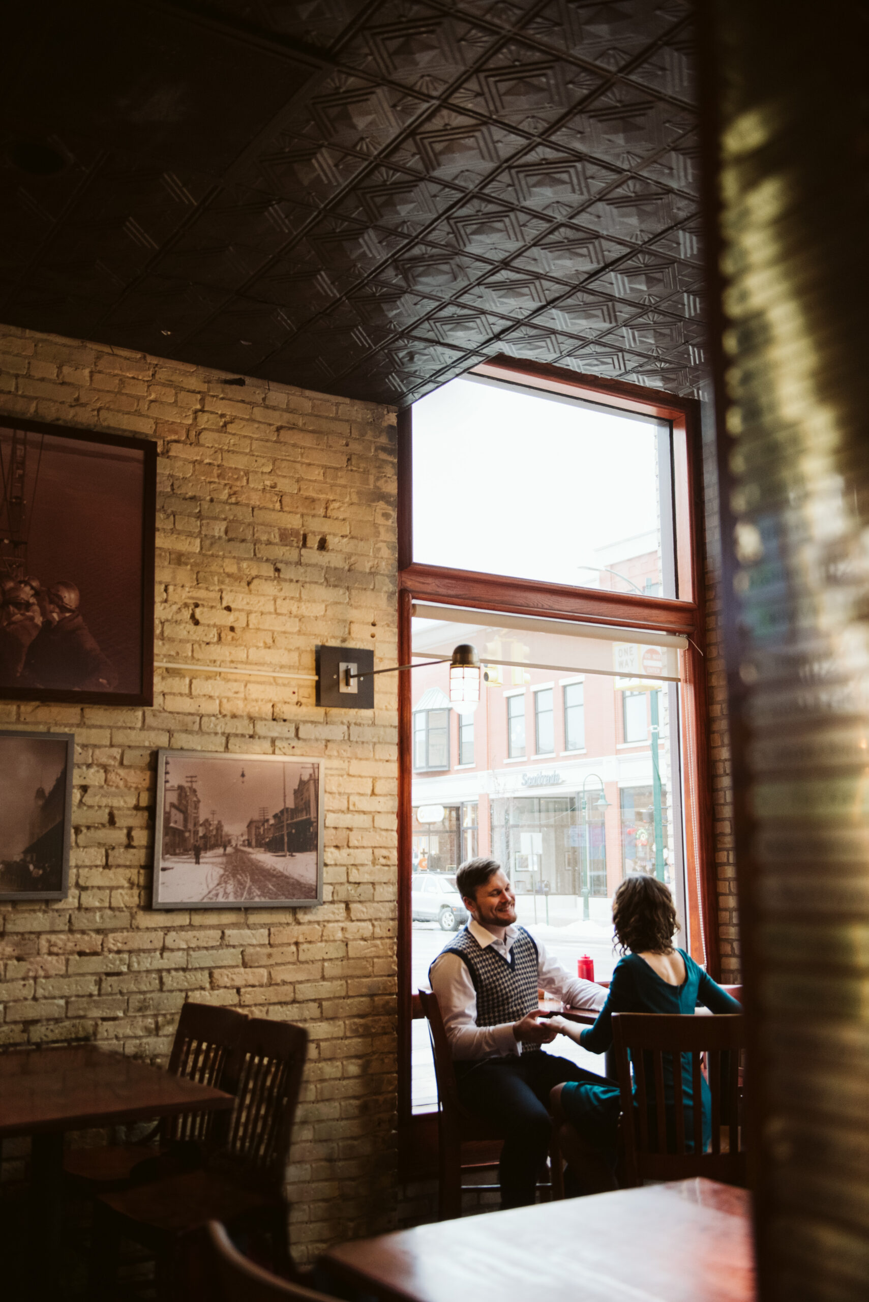 man and woman during engagement photos at bar in traverse city michigan