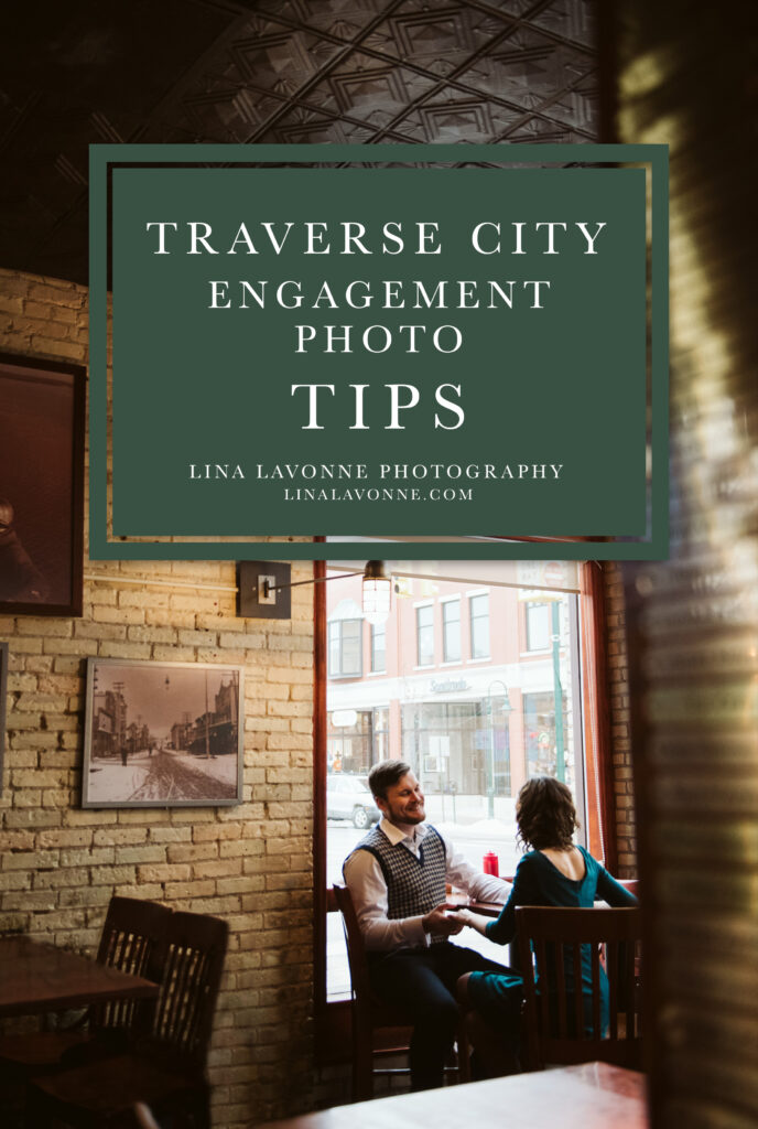 An engaged couple sitting together in a cozy downtown Traverse City bar during their engagement session. Text on image reads: ‘Traverse City Engagement Photo Tips – Lina Lavonne Photography, linalavonne.com’. Engagement photo inspiration by a Traverse City photographer