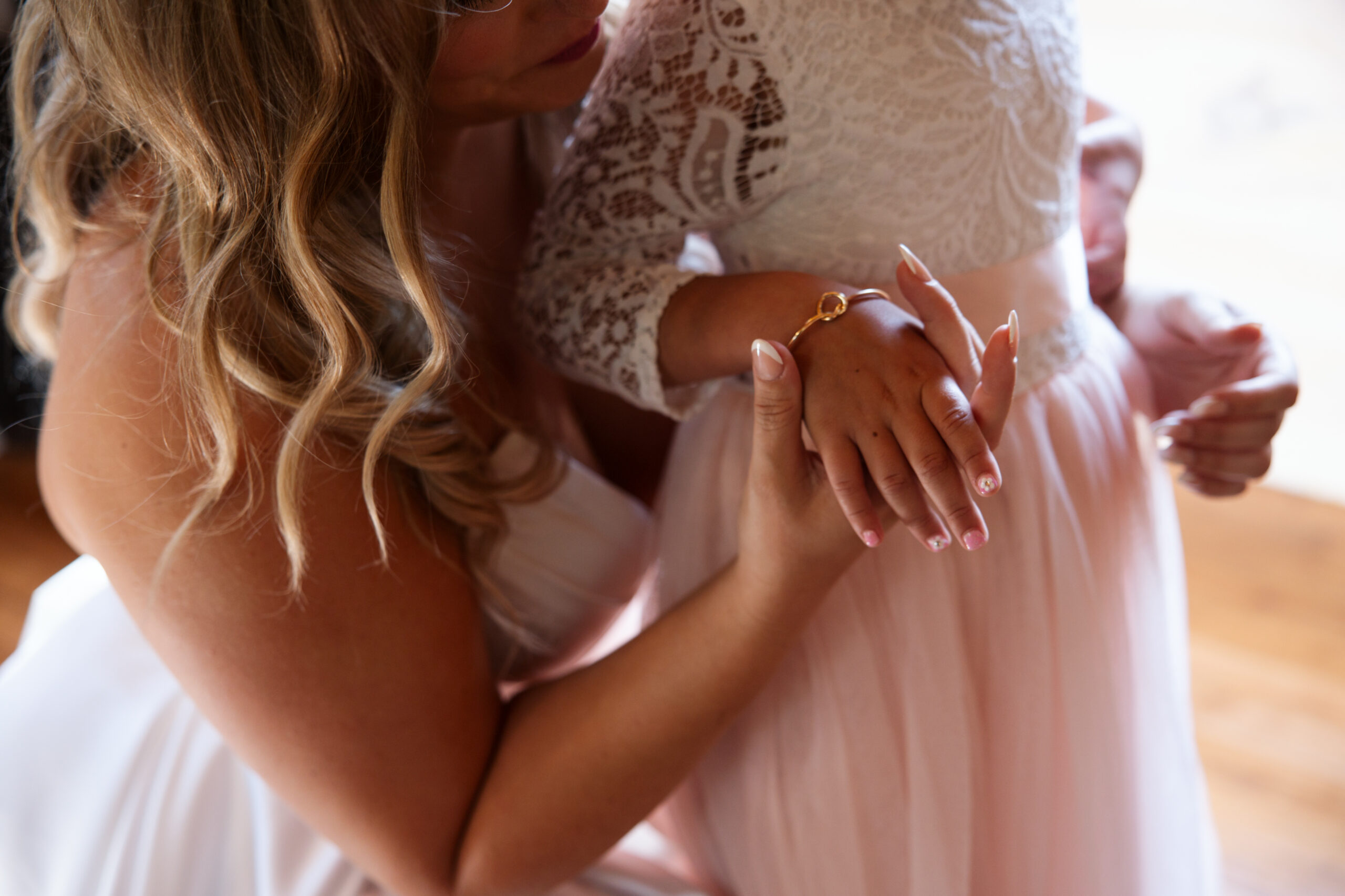 bride and daughters hands close up at wedding in glen arbor michigan