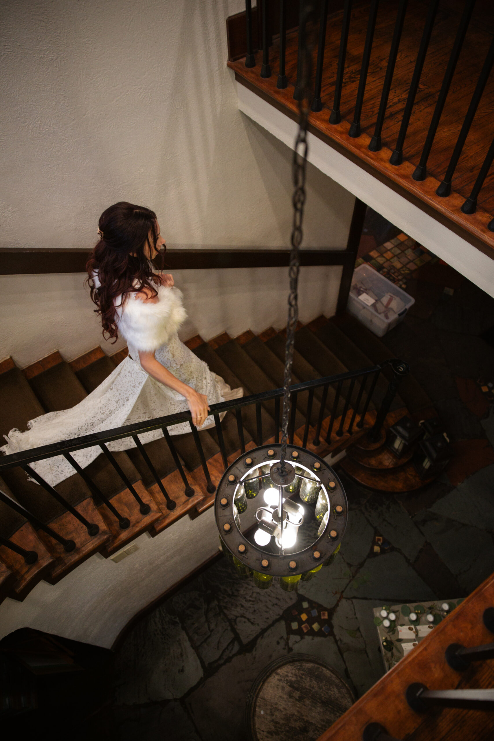 bride walking down the stairs before ceremony at the mission table peninsula room on old mission peninsula