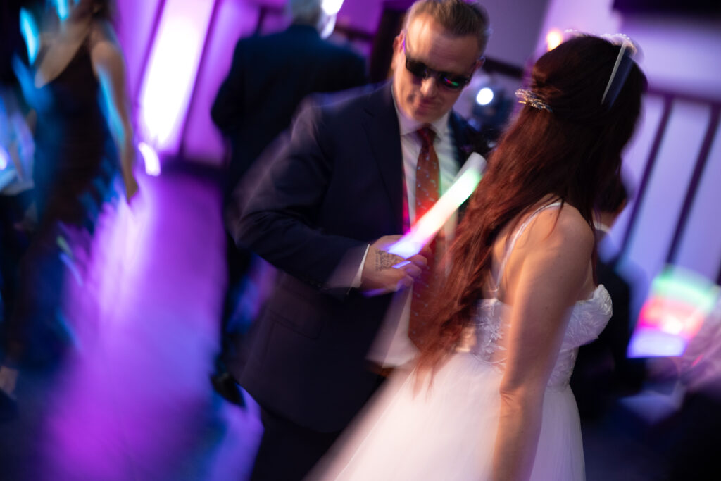 blurry artistic image of bride and groom dancing during reception at peninsula cellars wedding in traverse city michigan