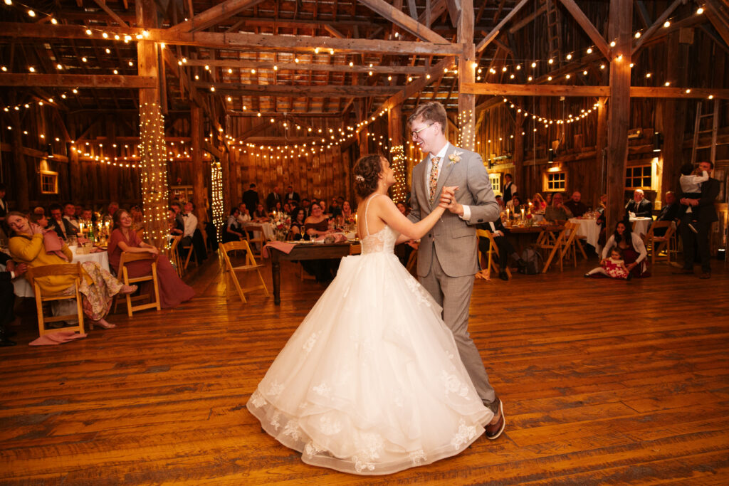 bride and groom dancing their first dance at a wedding reception at starry nigth barn