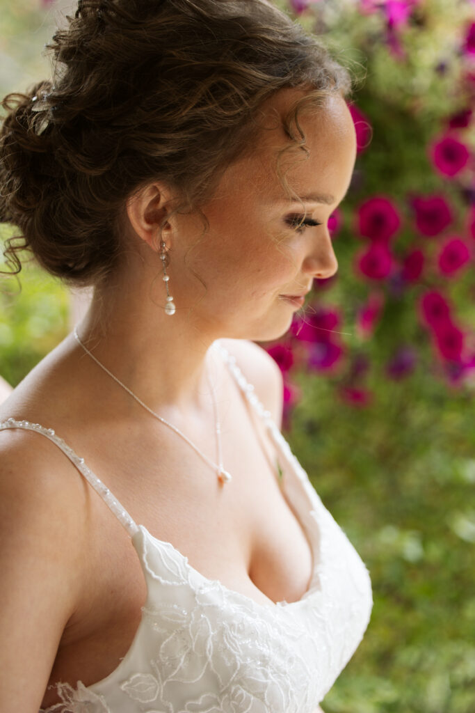 Starry-Night-Barn-Wedding-13 side profile of a bride looking down before her wedding in traverse city wedding