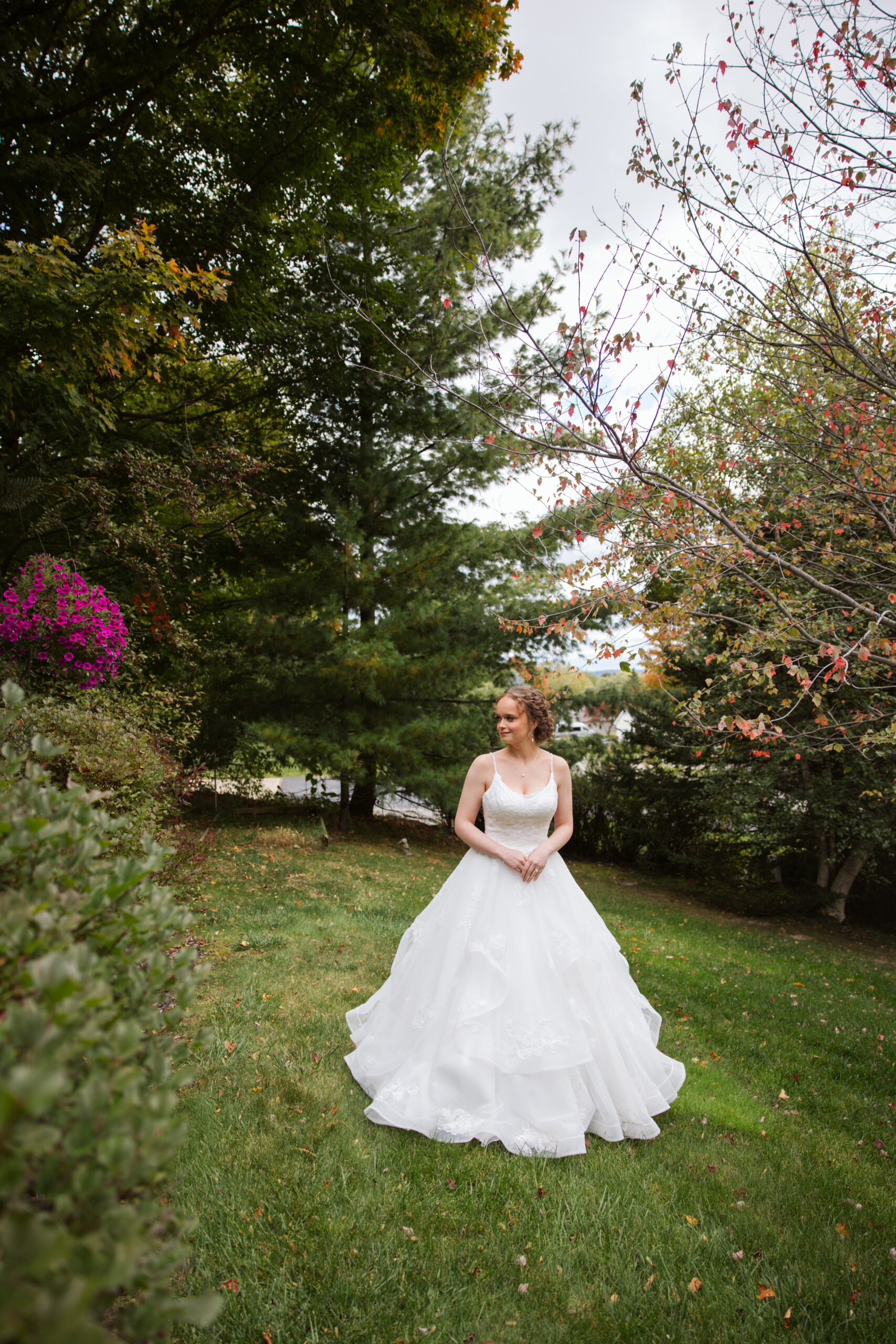 bride standing in a yard before her traverse city wedding