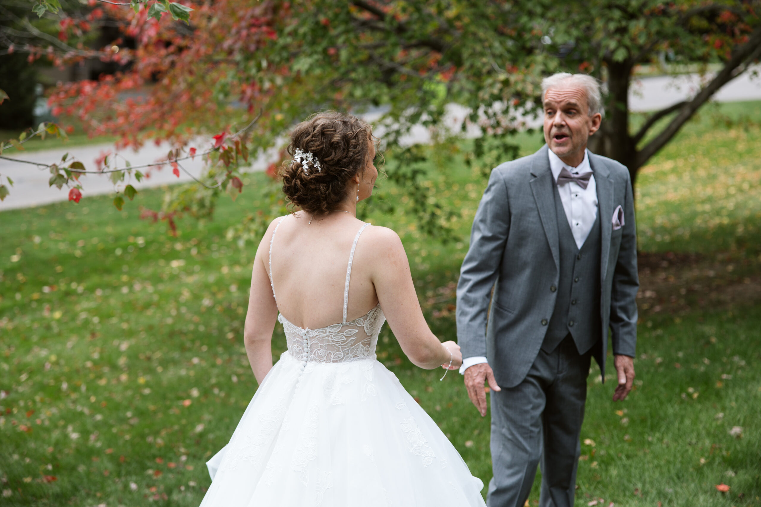 first look with bride and her father at traverse city wedding