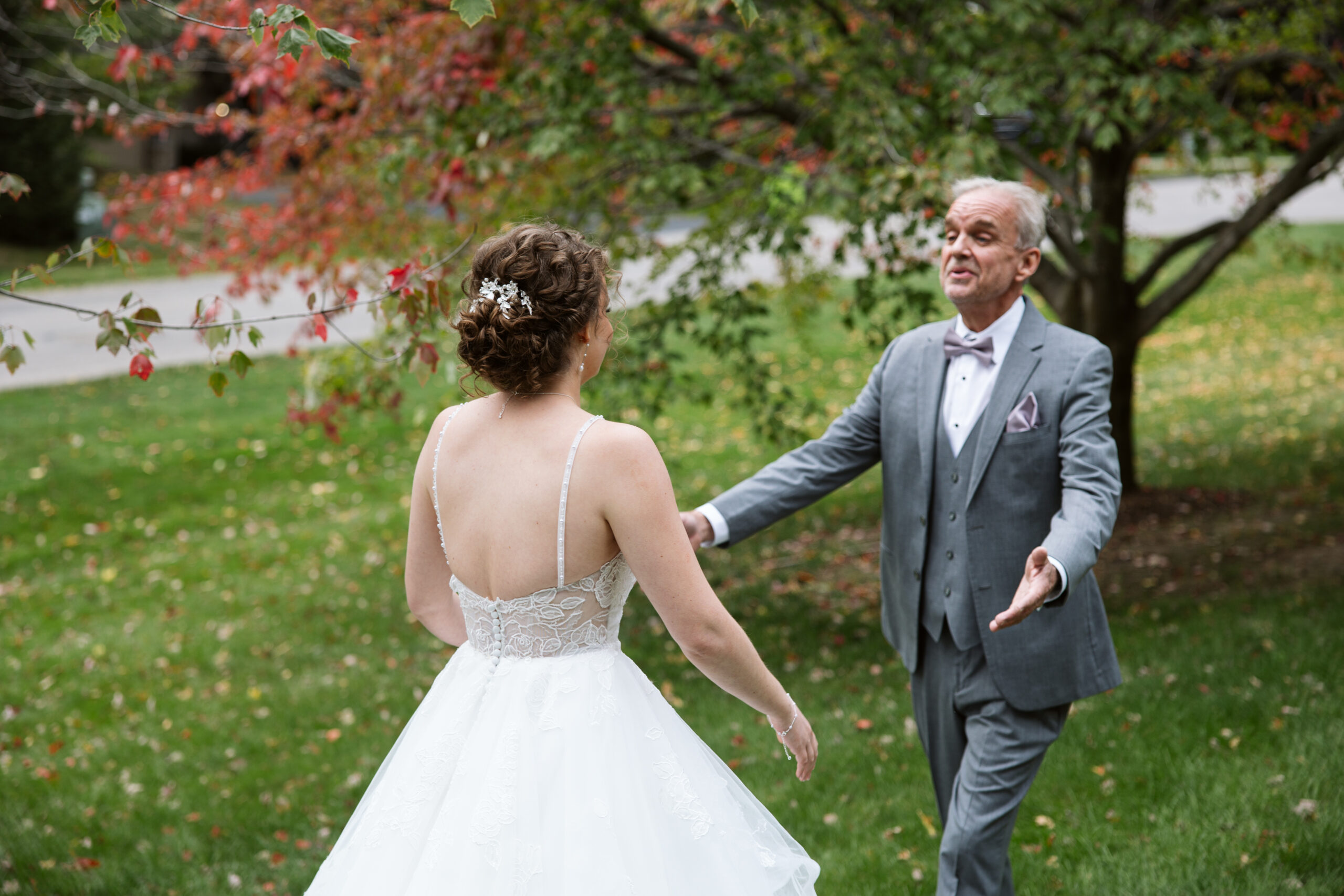first look with bride and her father at traverse city wedding