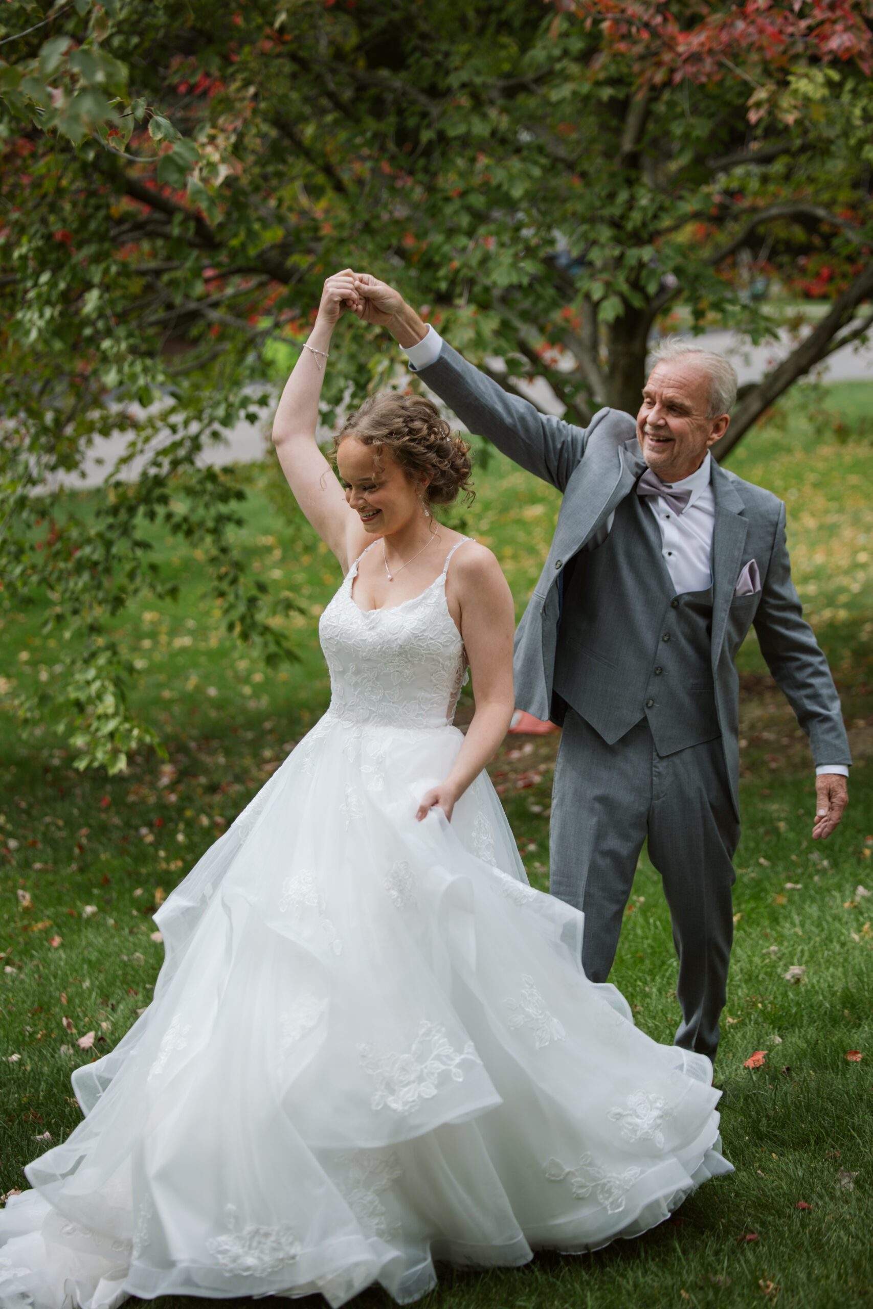 father of the bride dancing with his bride in traverse city michigan