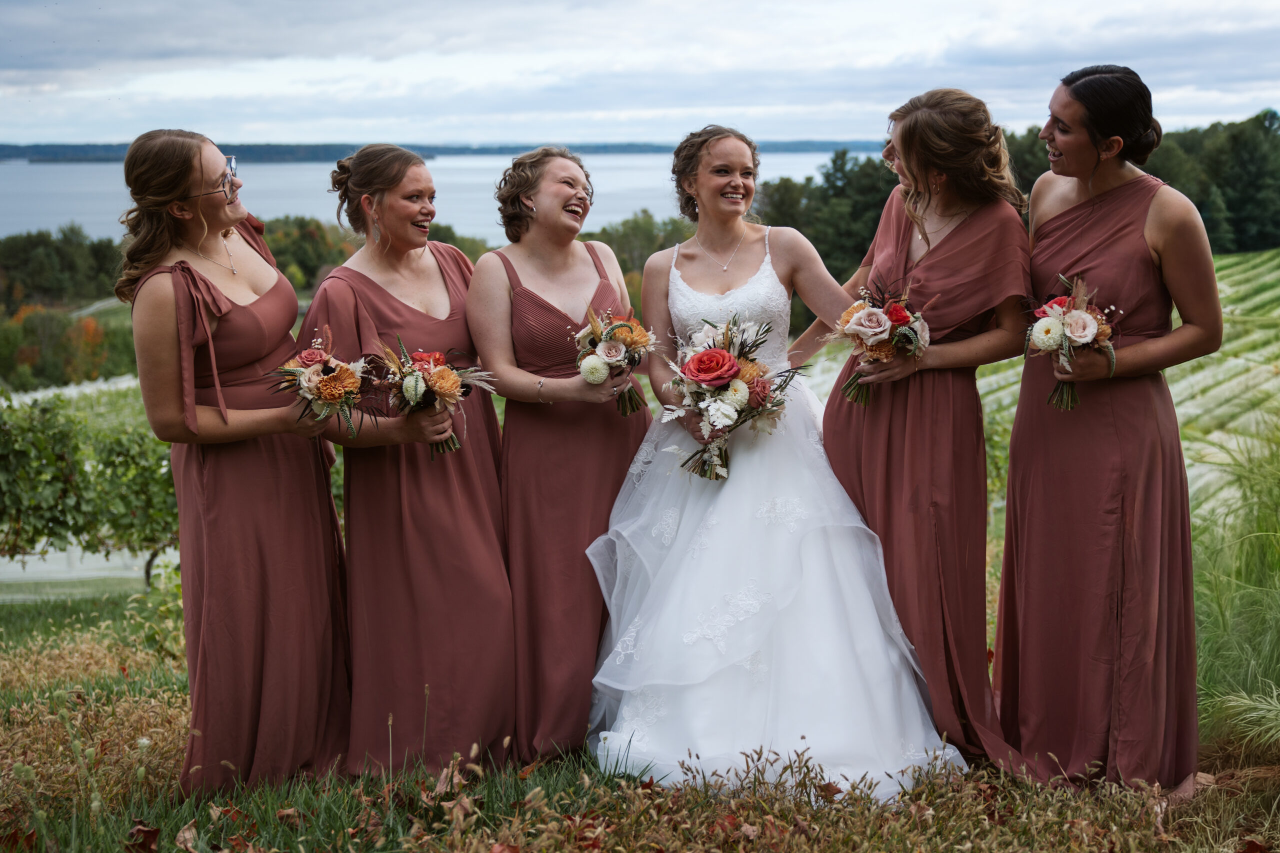 bride and bridesmaids at suttons bay wedding