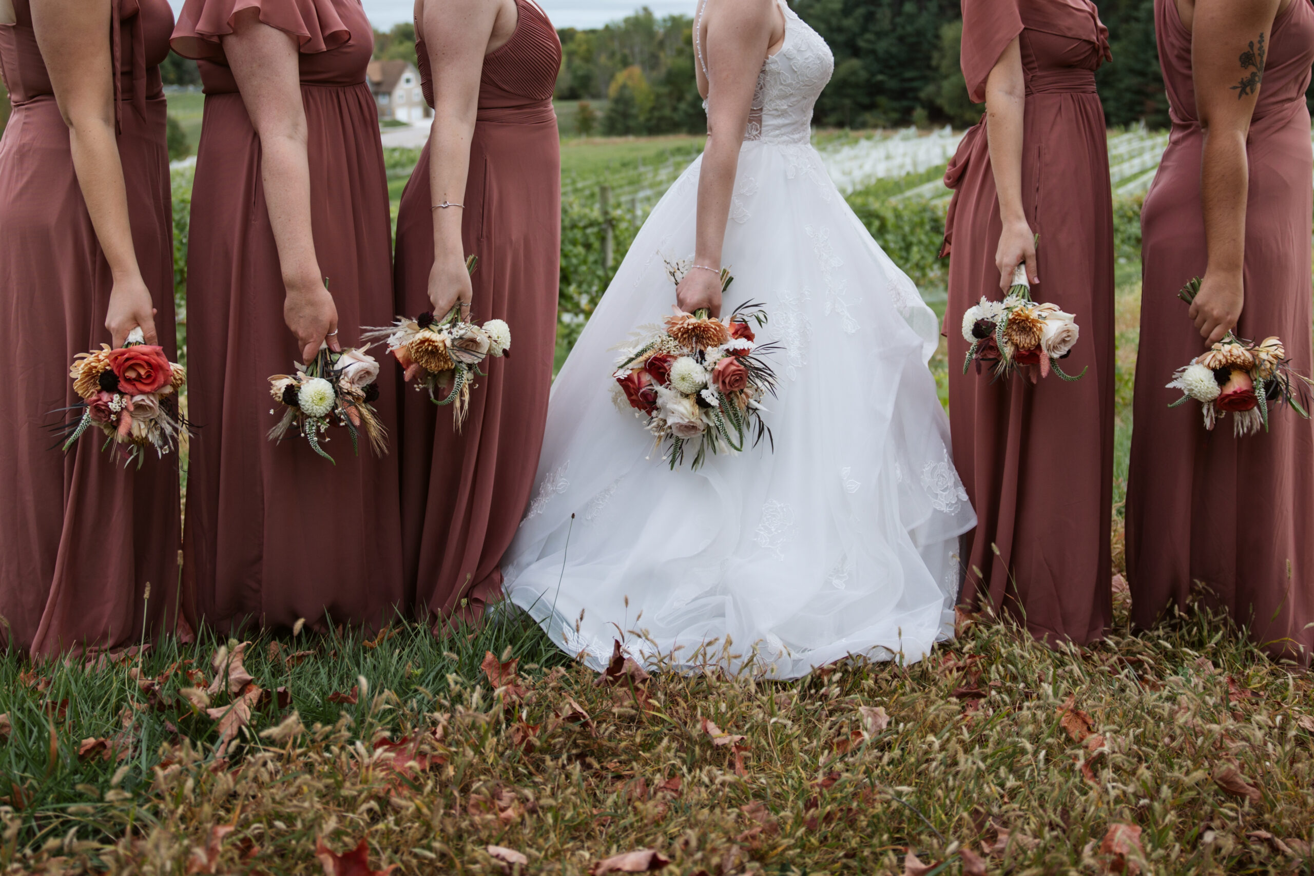 close up of bride and bridesmaid flowers at vineyard in suttons bay