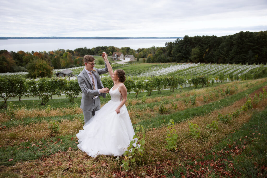 bride and groom dancing at vineyard at suttons bay michigan