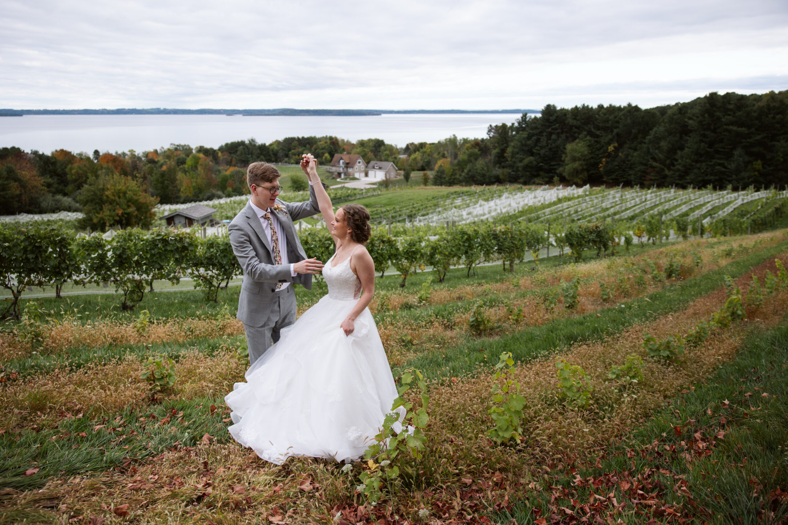 bride and groom dancing at vineyard at suttons bay michigan