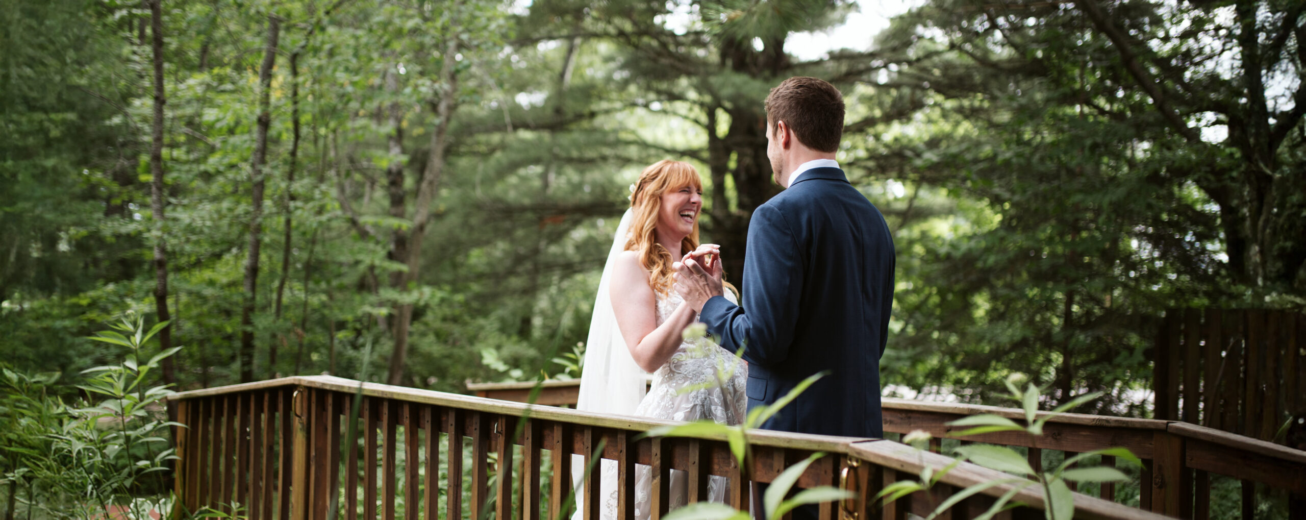 bride and groom during first look during traverse city wedding