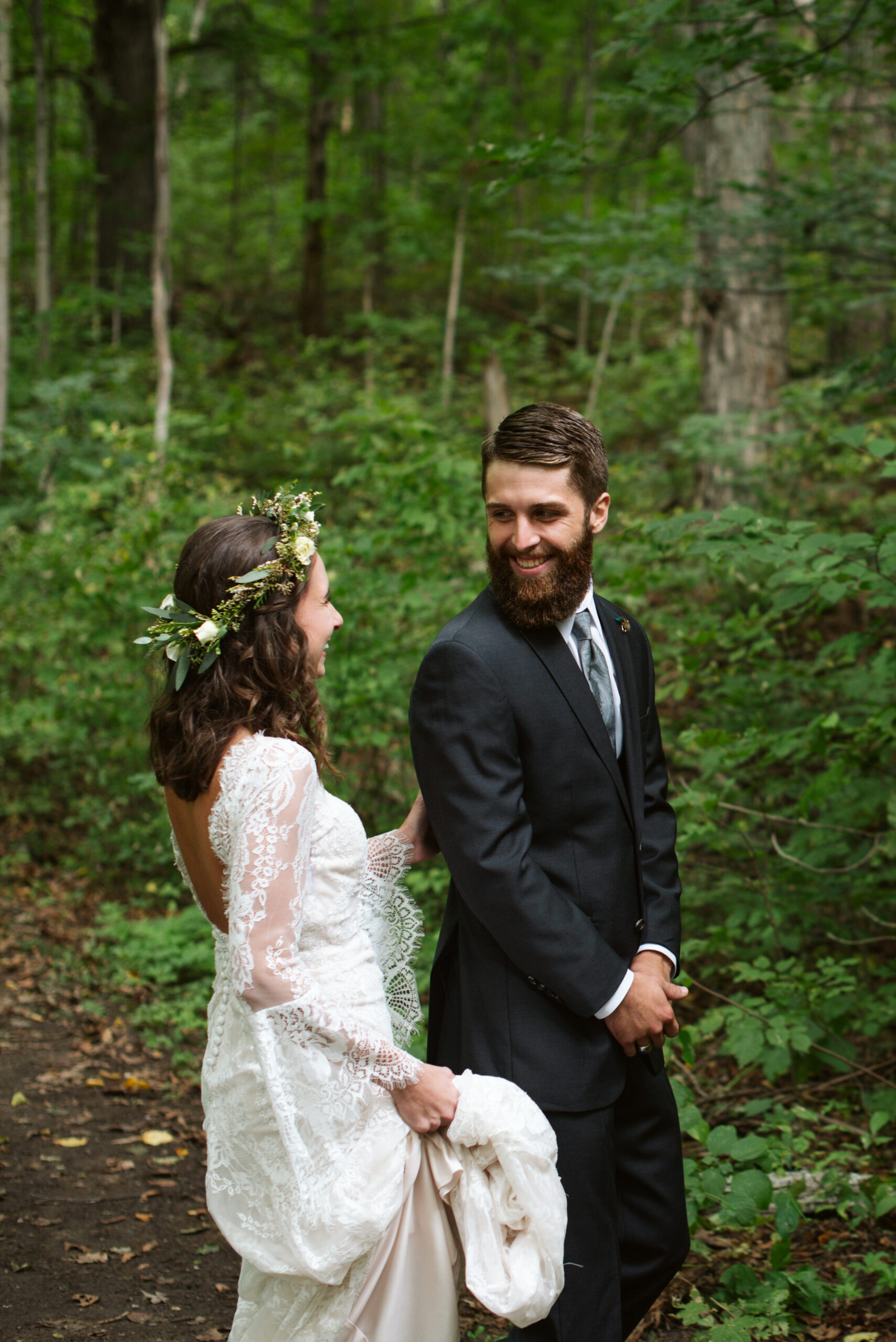 bride and groom during first look at wedding at twin lakes campground in traverse city