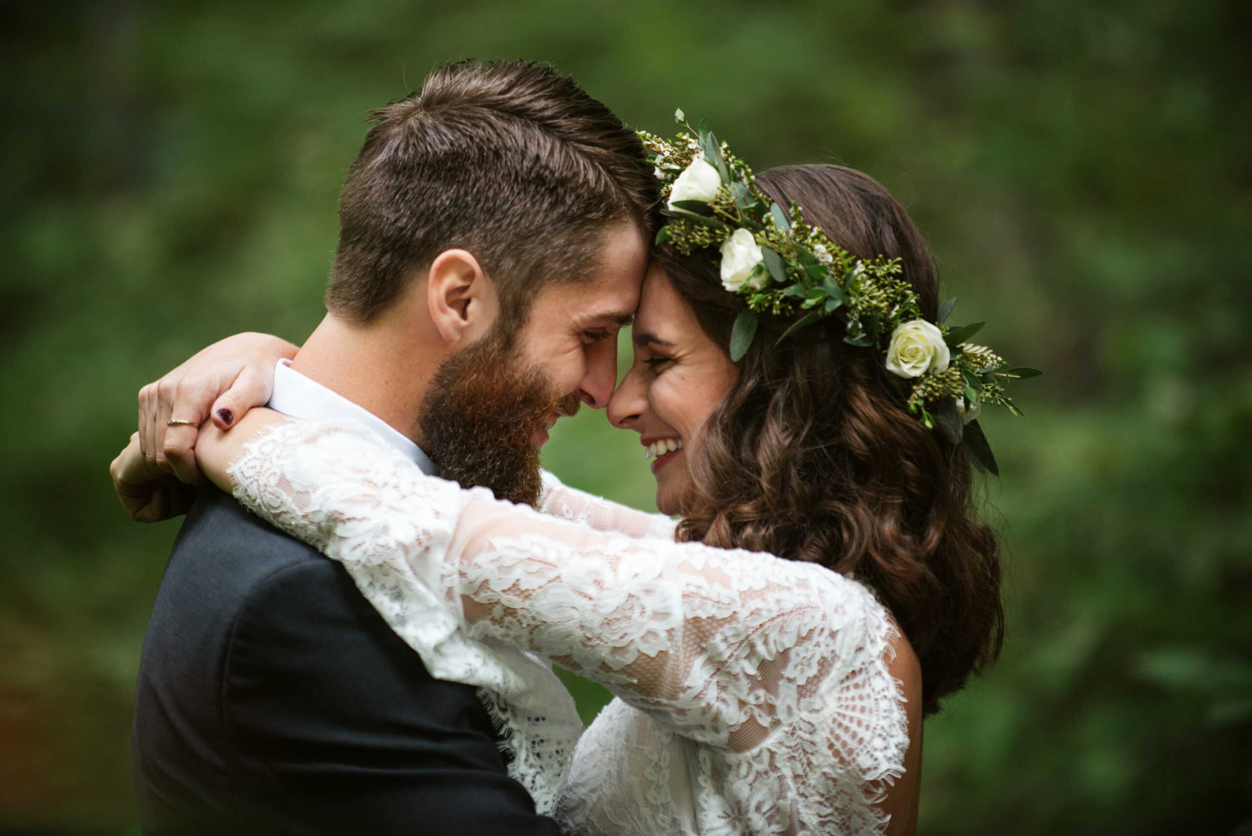 bride and groom laughing during wedding at twin lakes campground in traverse city