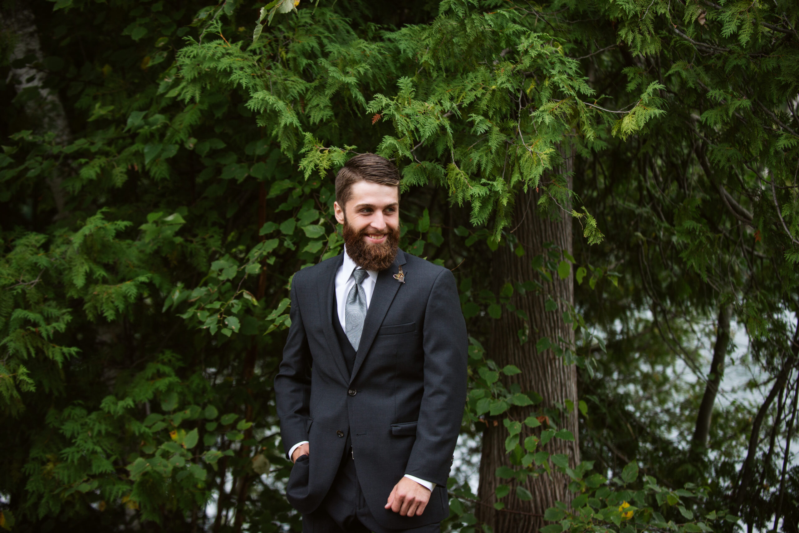 groom during wedding at twin lakes campground in traverse city