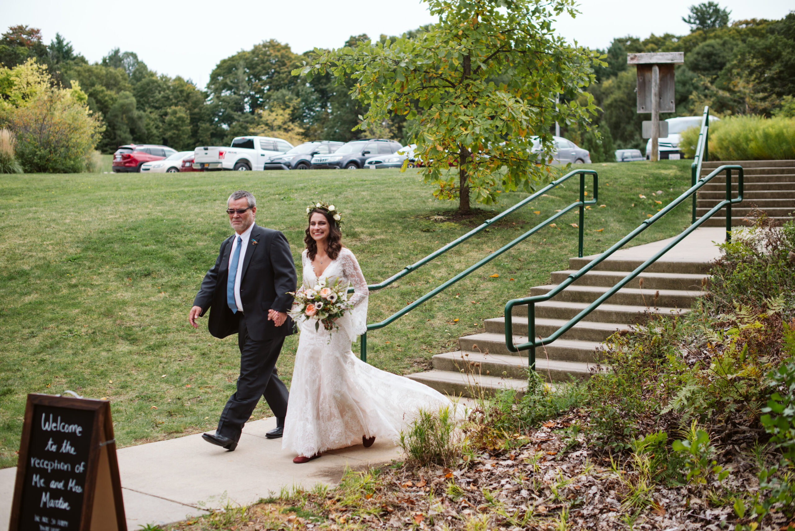 bride waling down aisle during wedding at twin lakes campground in traverse city