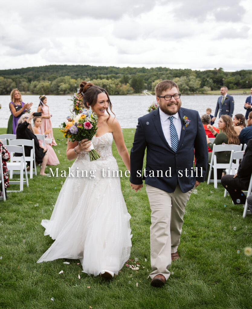 bride and groom walking down wedding aisle in traverse city. northern michigan wedding photography