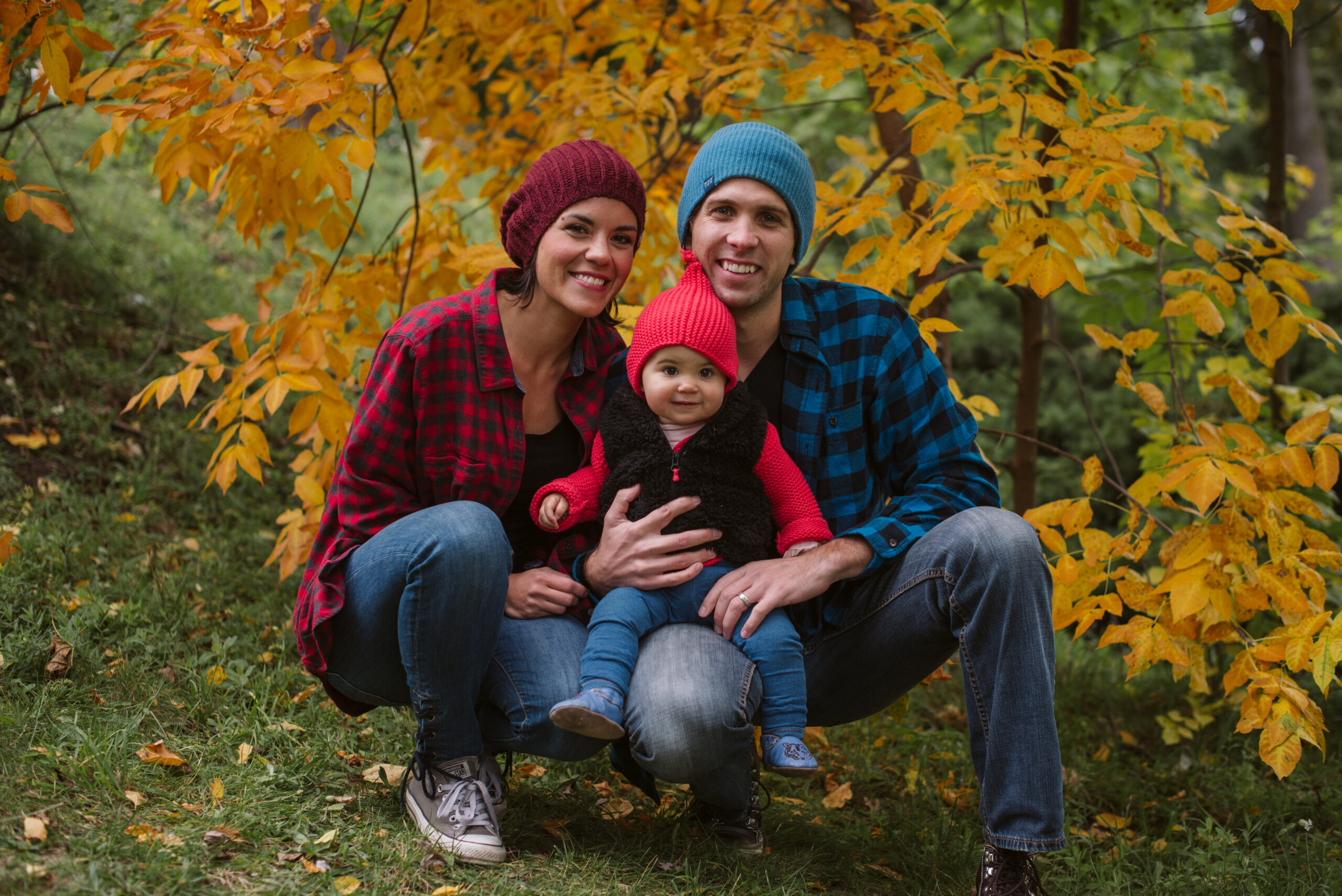 family posing for fall family photos in traverse city michigan