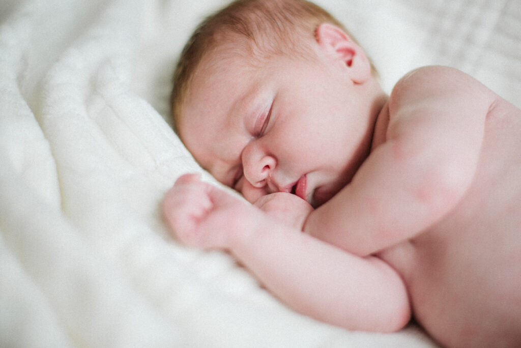 baby girl during newborn photos in traverse city northern michigan photographer
