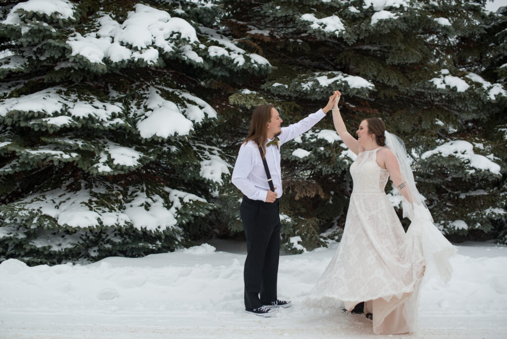 bride and groom dancing in the snow at grand traverse resort in traverse city michigan