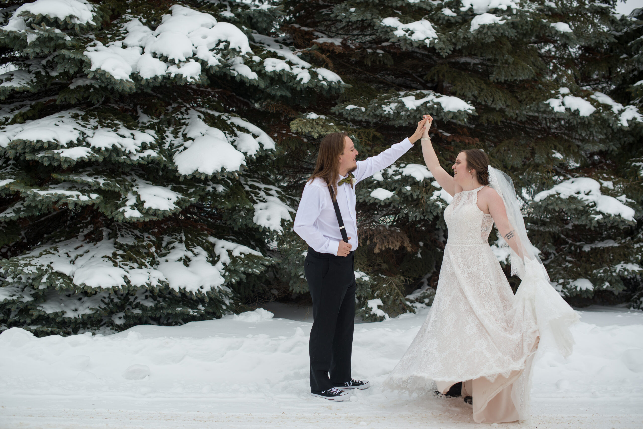 bride and groom dancing in the snow at grand traverse resort in traverse city michigan