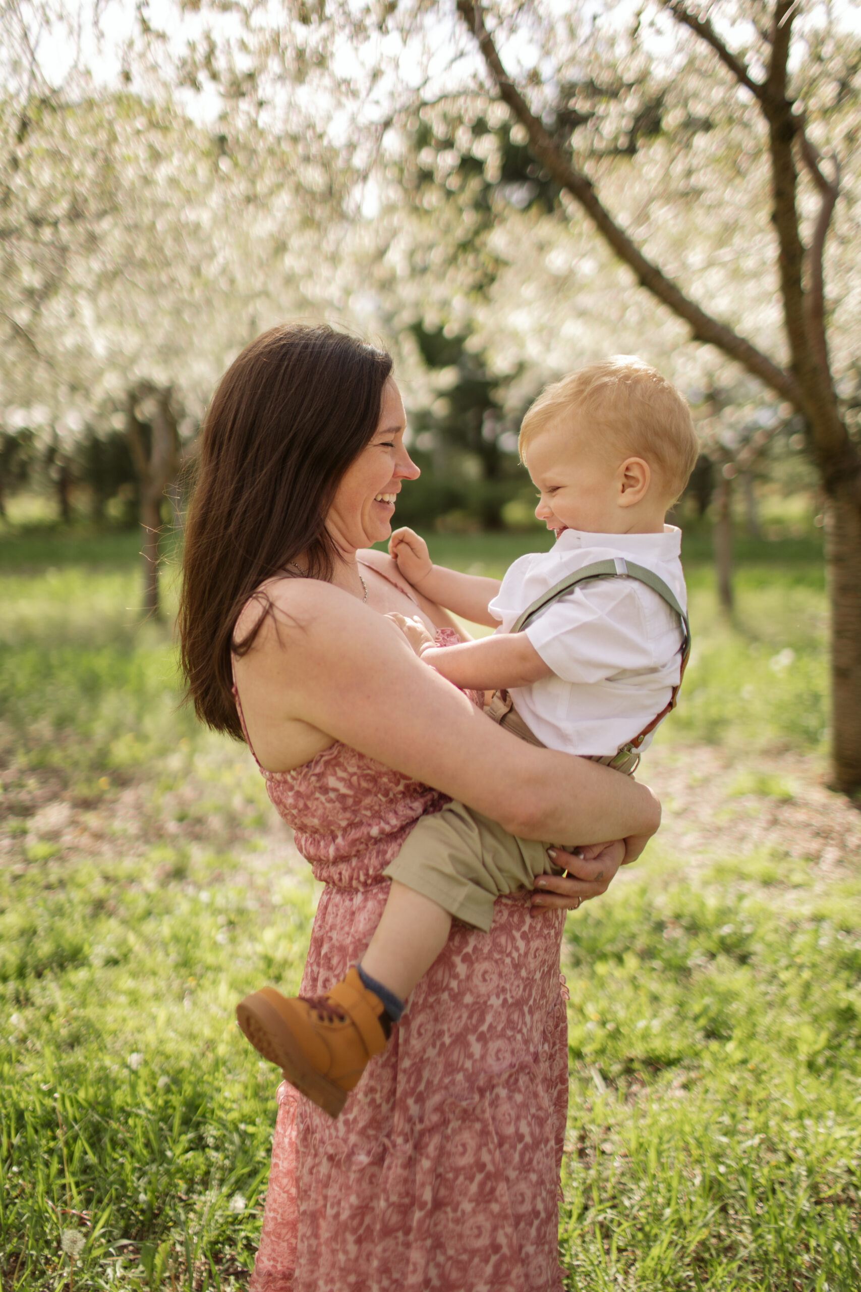 mother and son during blossoms in empire michigan family session