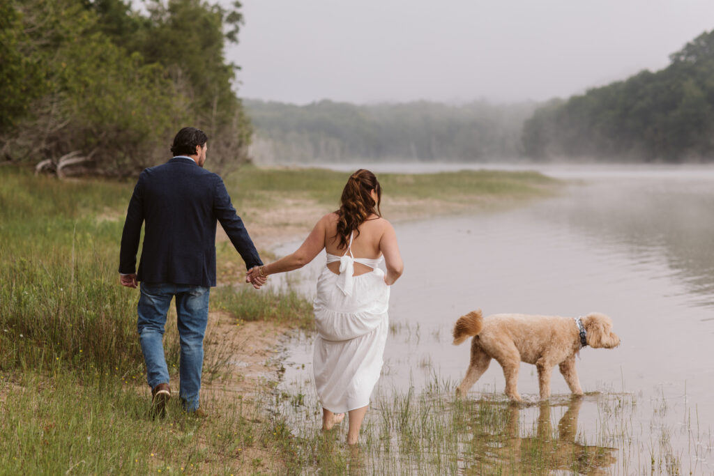bride and groom in empire michigan during engagement photos
