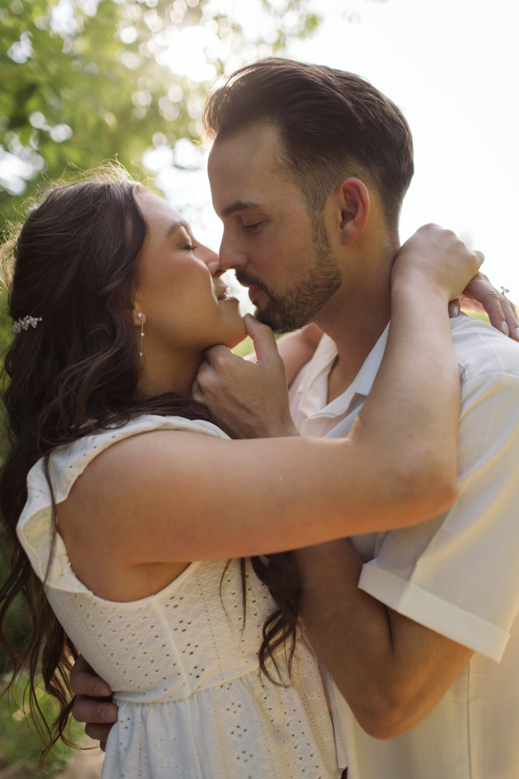 man and woman on glen haven beach in glen arbor michigan during engagement photos
