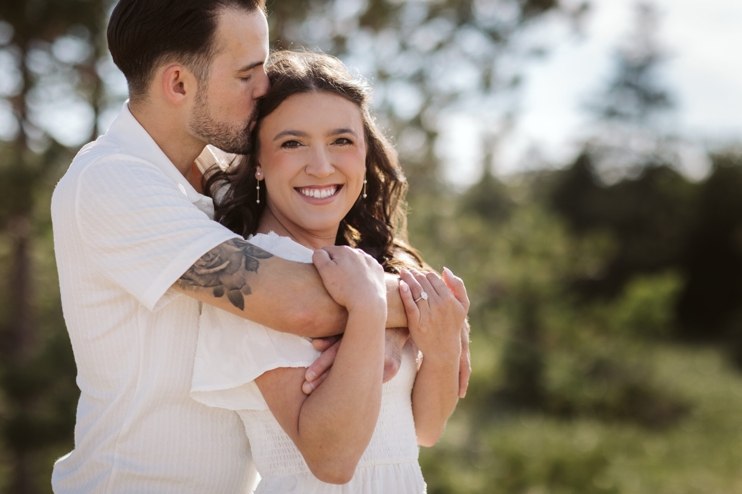 bride and groom on glen haven beach in glen arbor michigan during engagement photos