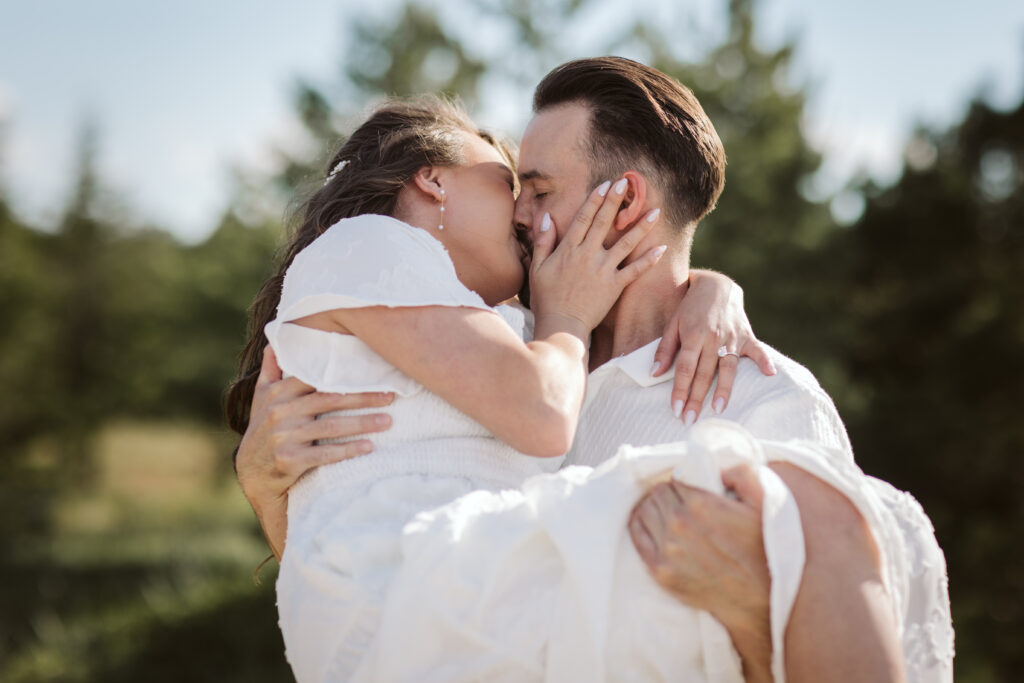 man and woman on glen haven beach in glen arbor michigan during engagement photos