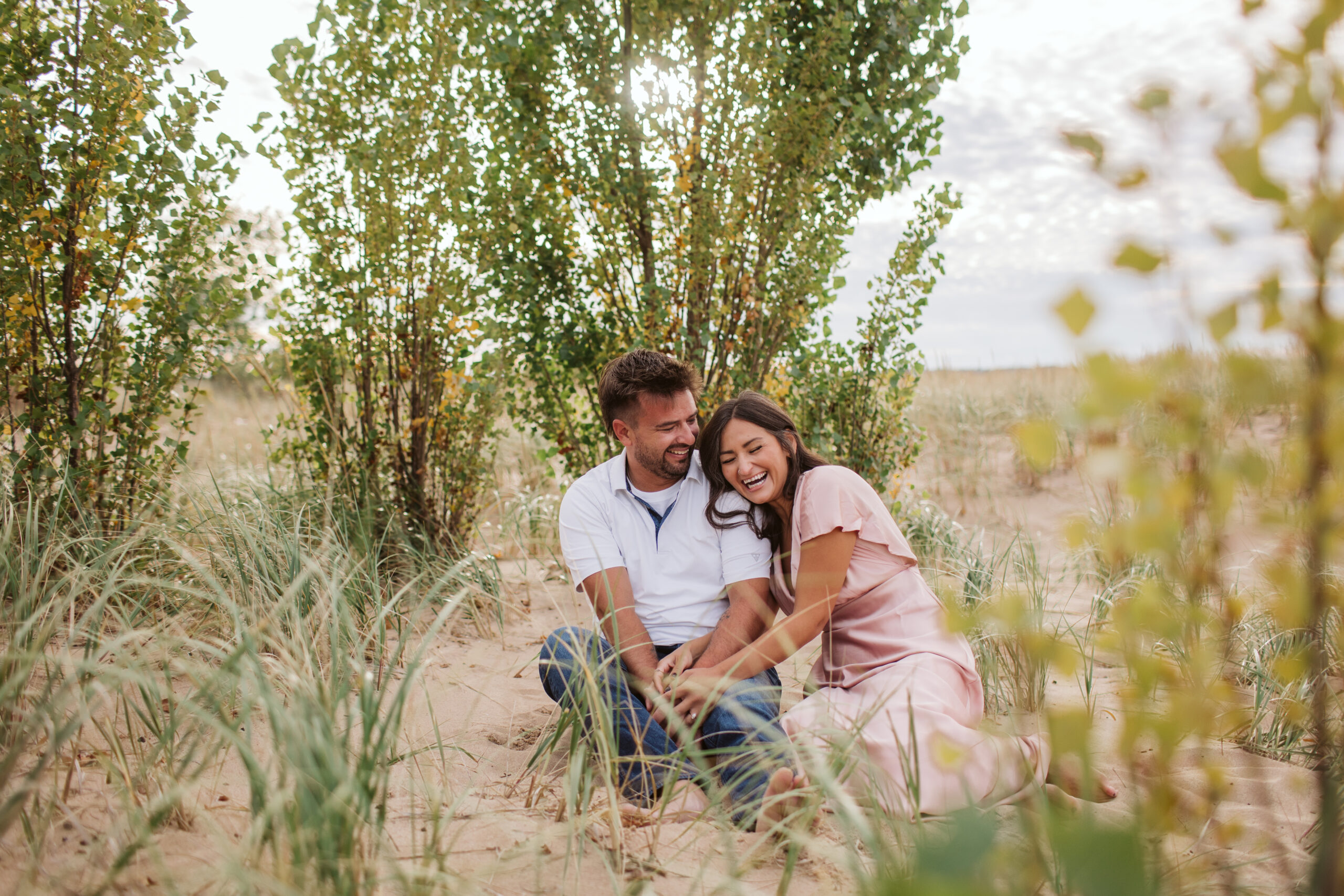 elk-rapids-wedding-photographer bride and groom on elk rapids beach in michigan during engagement photos wedding photographer