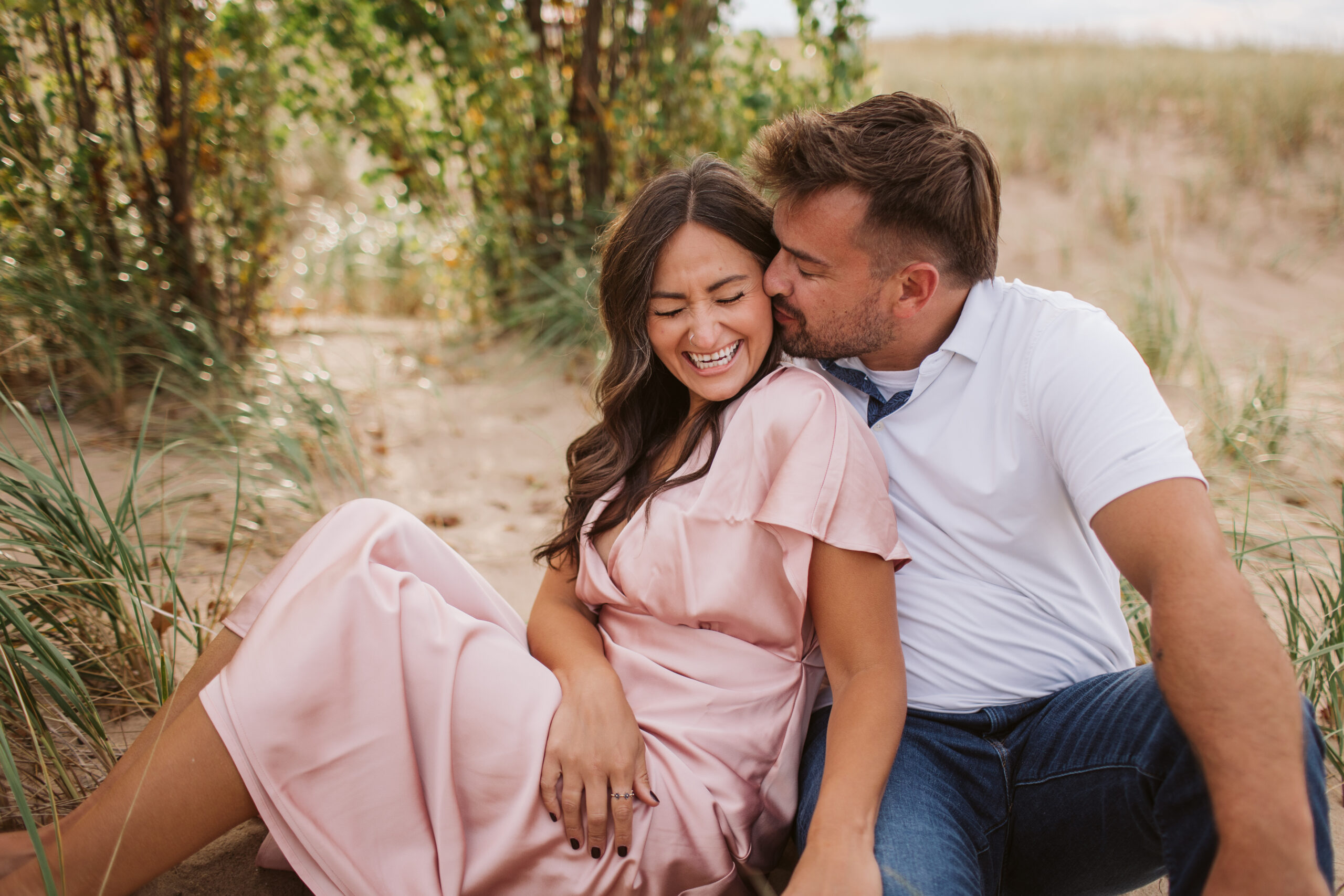 elk-rapids-wedding-photographer bride and groom on elk rapids beach in michigan during engagement photos wedding photographer