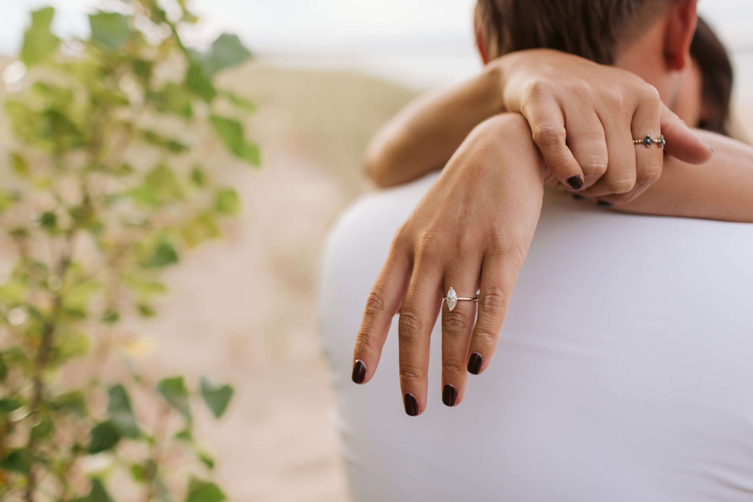elk-rapids-wedding-photographer bride and groom on elk rapids beach in michigan during engagement photos wedding photographer